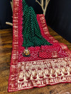 Green and red color hand bandhej silk saree with zari weaving work