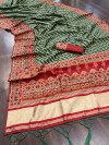 Bottle green color soft cotton patola saree with woven design