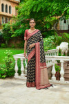 Black color soft raw silk saree with woven design