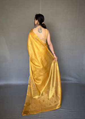 Mustard yellow color tissue silk saree with zari weaving work