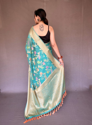 Sea green color linen silk saree with woven design