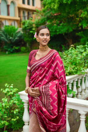 Pink color soft raw silk saree with woven design
