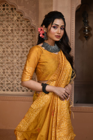 Yellow color handloom raw silk saree with woven design