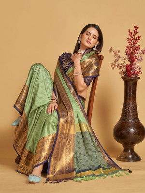 Light green color cotton silk saree with woven design