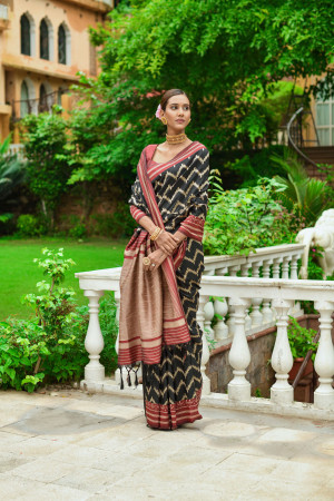 Black color soft raw silk saree with woven design