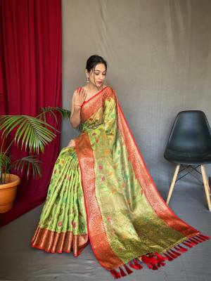 Pista green color tissue silk saree with zari weaving work