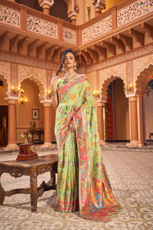 Pista green color banarasi silk saree with woven design