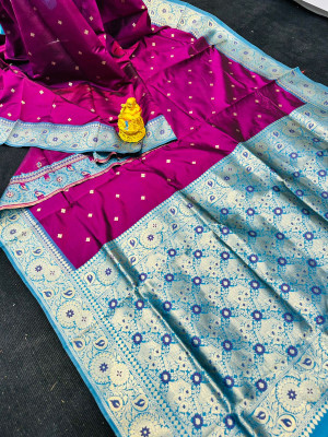 Magenta color lichi silk saree with zari weaving work