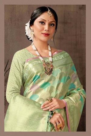 Sea green color organza silk saree with zari weaving work