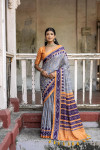 Gray color soft tussar silk saree with ikkat printed work
