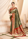 Olive green color soft tissue paithani silk saree with zari weaving work