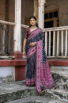 Black color soft tussar silk saree with ikat printed work