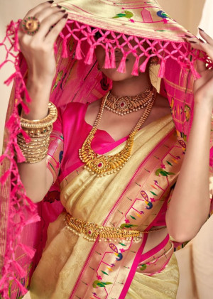 Cream color soft tissue paithani silk saree with zari weaving work