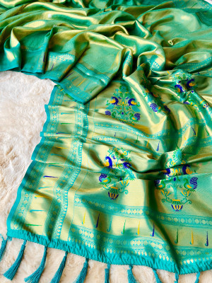 Rama green color soft tissue paithani silk saree with zari weaving work