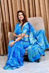 Sky blue color pure bandhej silk saree with zari weaving border
