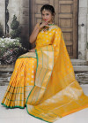 Yellow color lichi silk saree with silver zari work