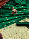 Green color banarasi silk saree with zari and minakari work