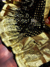 Black color banarasi soft silk saree with gold zari woven border