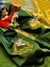 Green color soft lichi silk saree with attractive gold and silver zari weaving work