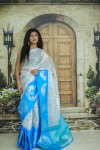 Blue and silver color tissue silk saree with zari weaving work