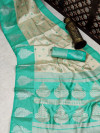 Sea green and off white color banarasi art silk saree with zari weaving work
