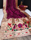 Magenta color paithani silk saree with zari weaving contrast work