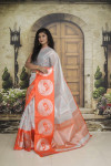 Orange and silver color tissue silk saree with zari weaving work