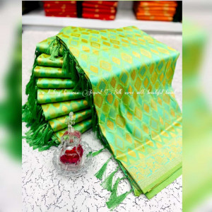 Parrot green color banarasi silk saree with golden zari weaving work