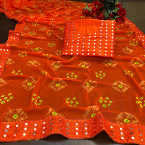 Orange color georgette bandhani saree with border work