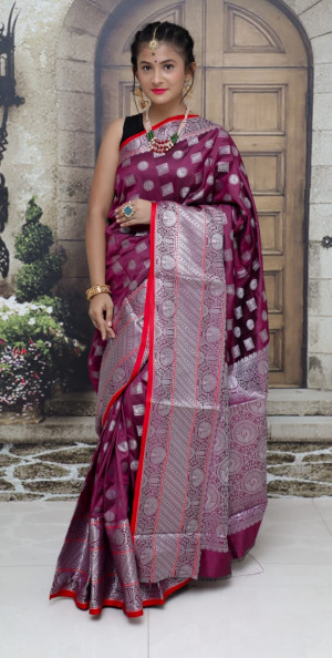Magenta color lichi silk saree with silver zari work