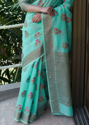 Sea green color linen cotton saree with zari weaving border