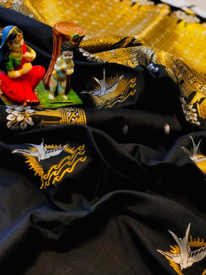 Black color soft lichi silk saree with attractive gold and silver zari weaving work