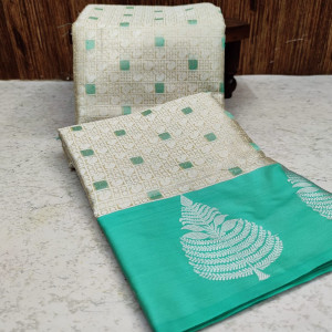 Sea green and off white color banarasi art silk saree with zari weaving work