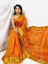 Yellow color bandhani silk saree with khadi printed work