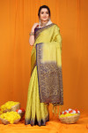 Pista green color muslin silk saree with zari woven work