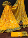 Yellow color pure hand bandhej silk saree with printed work
