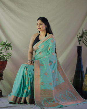 Sea green color tussar silk saree with golden zari weaving work
