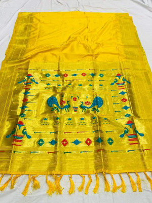 Yellow color paithani silk saree with zari woven work