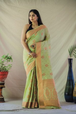 Pista green color tussar silk saree with golden zari weaving work