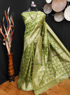 Mahendi green color raw silk saree with woven design