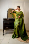 Mahendi green color handloom raw silk saree with woven design