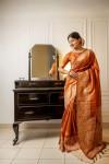Orange color handloom raw silk saree with woven design