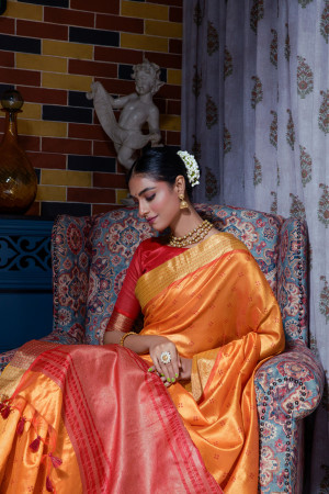 Orange color tussar silk saree with zari weaving work