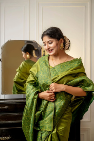 Mahendi green color handloom raw silk saree with woven design