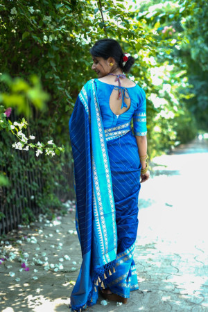 Navy blue color soft raw silk saree with woven design