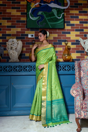 Parrot green color tussar silk saree with zari weaving work