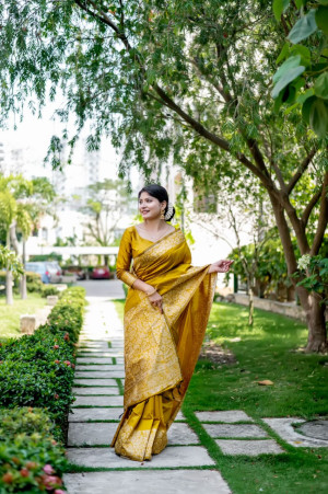 Mustard yellow color handloom raw silk saree with woven design