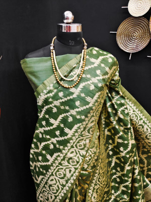 Bottol green color raw silk saree with woven design
