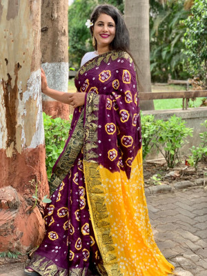 Yellow and magenta color soft hand bandhej silk saree with zari weaving work