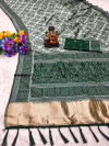 Green flowy dola silk saree with bandhej woven border & lagdi patta pallu